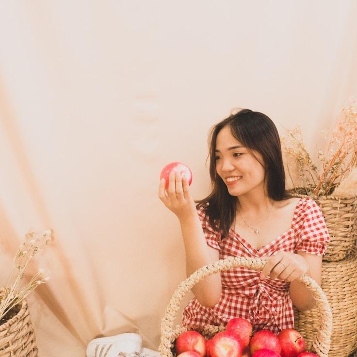 Kaveri Mehta, Lead Design Curator at PlainLedgerPilot, reviewing corporate floral arrangements